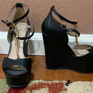 Black Aldo heels with a light snakeskin accent